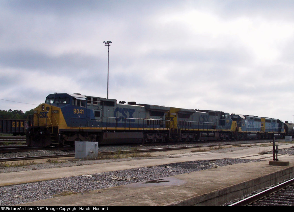 CSX 9041 has brought a train into the yard